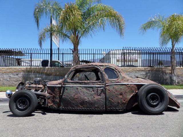 This 1938 Dodge bodied rat rod had been punished at one time with 100s of b...